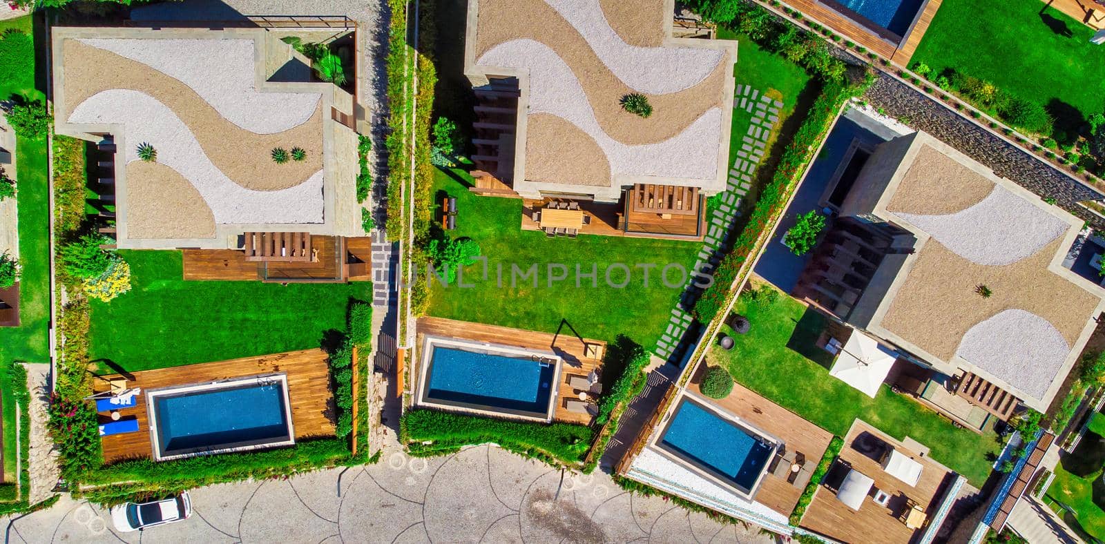 Swimming Pool viewed from above. Top down view of modern luxury villa with swimming pool