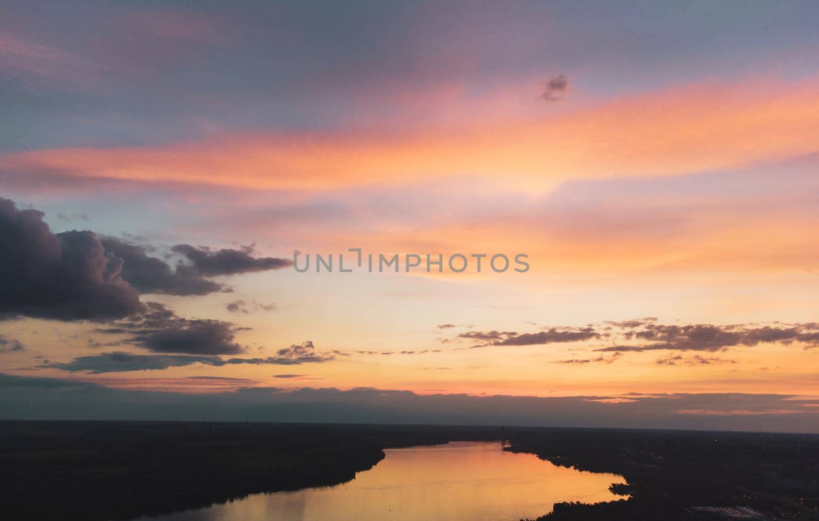 River water in beautiful sunset with clouds, landscape view