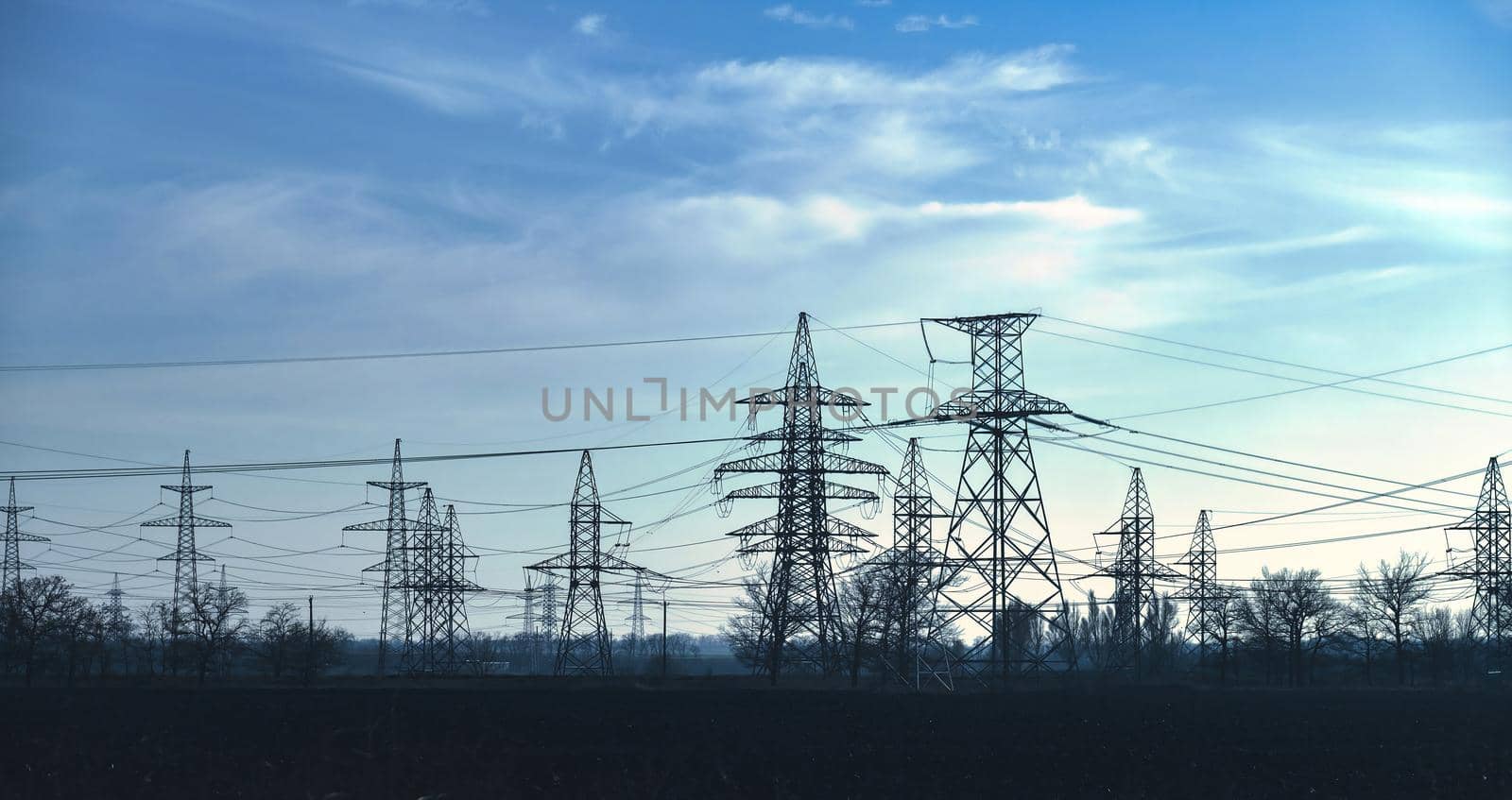 High voltage tower construction, beautiful landscape, blue sky, clean energy. global warming by igor010