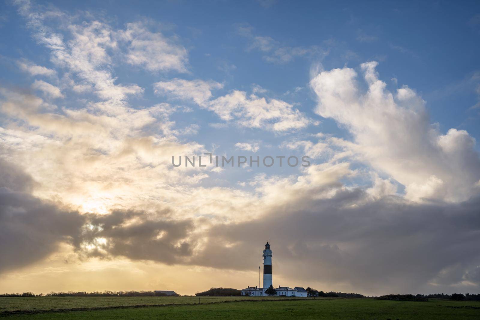 Panoramic image of Kampen lighthouse against dramatic sky, Sylt, North Frisia, Germany 