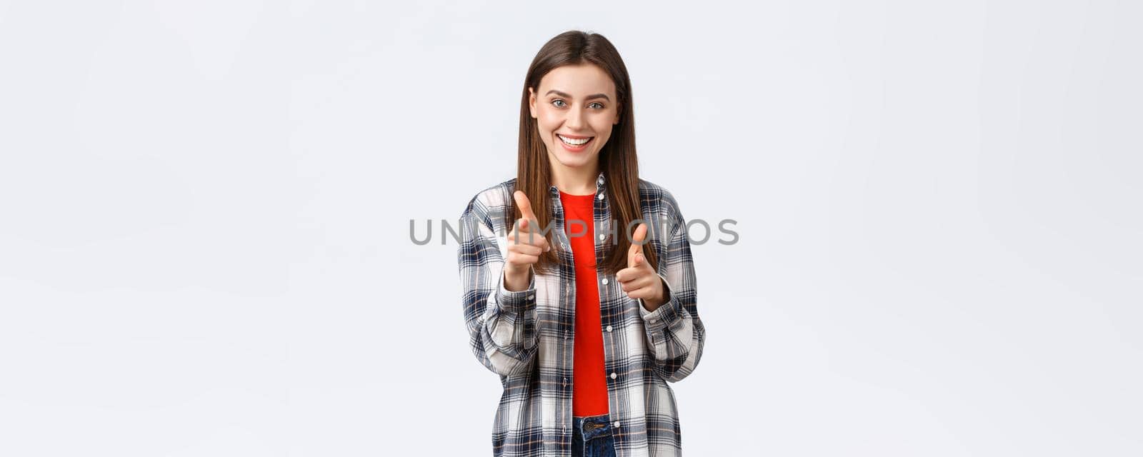 Lifestyle, different emotions, leisure activities concept. Enthusiastic and happy young pretty girl in casual outfit pointing fingers at camera, gotcha or congratulations gesture, choosing you by Benzoix