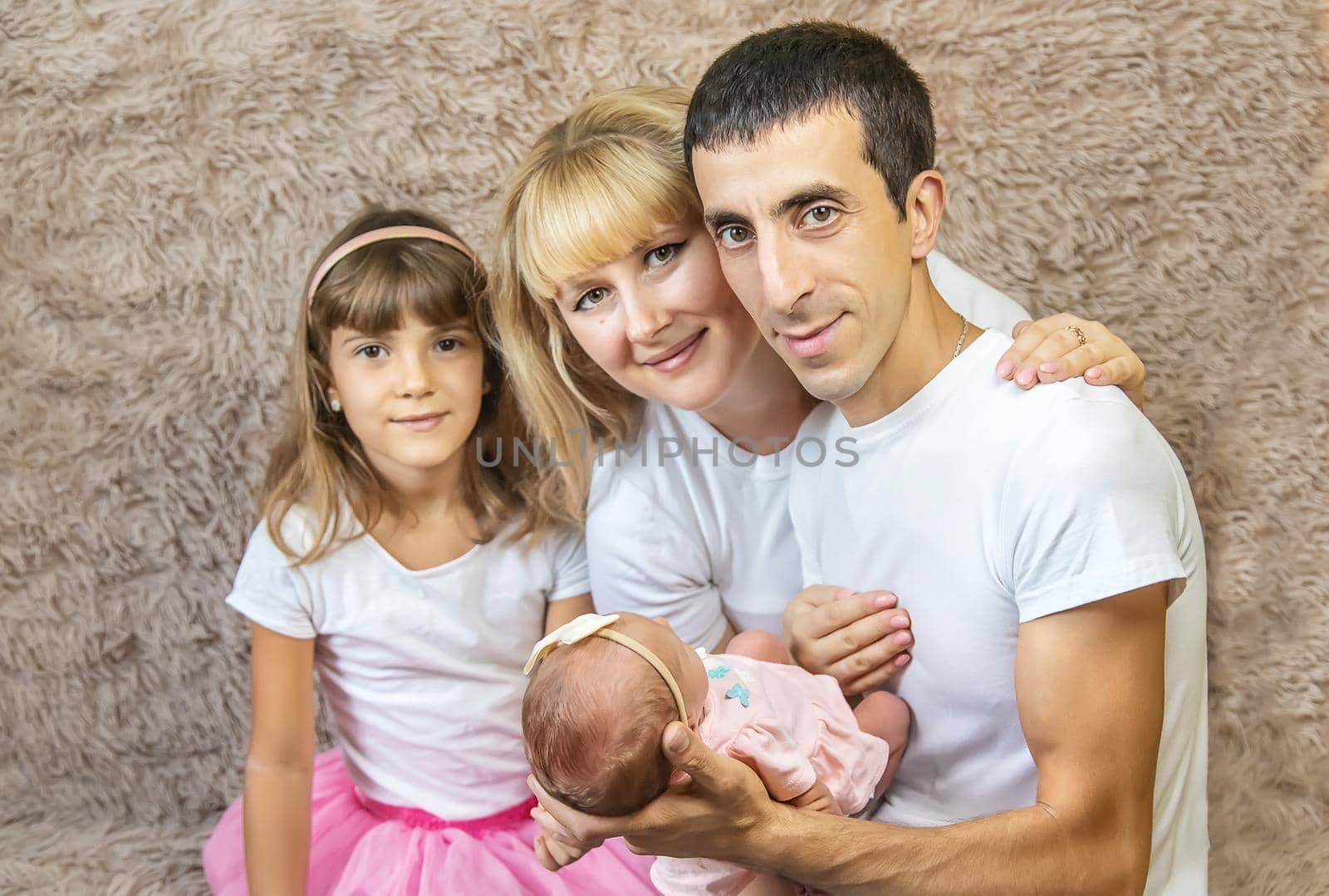 family photo with a newborn. selective focus. people.