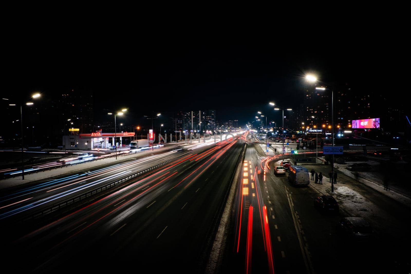 Speed Traffic with white and red trails on city road, long exposure. Kiev city by igor010