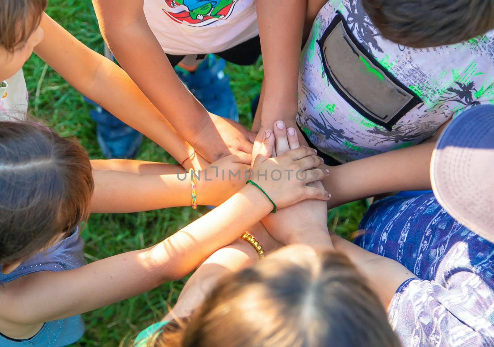 The children put their hands together. Selective focus. by yanadjana