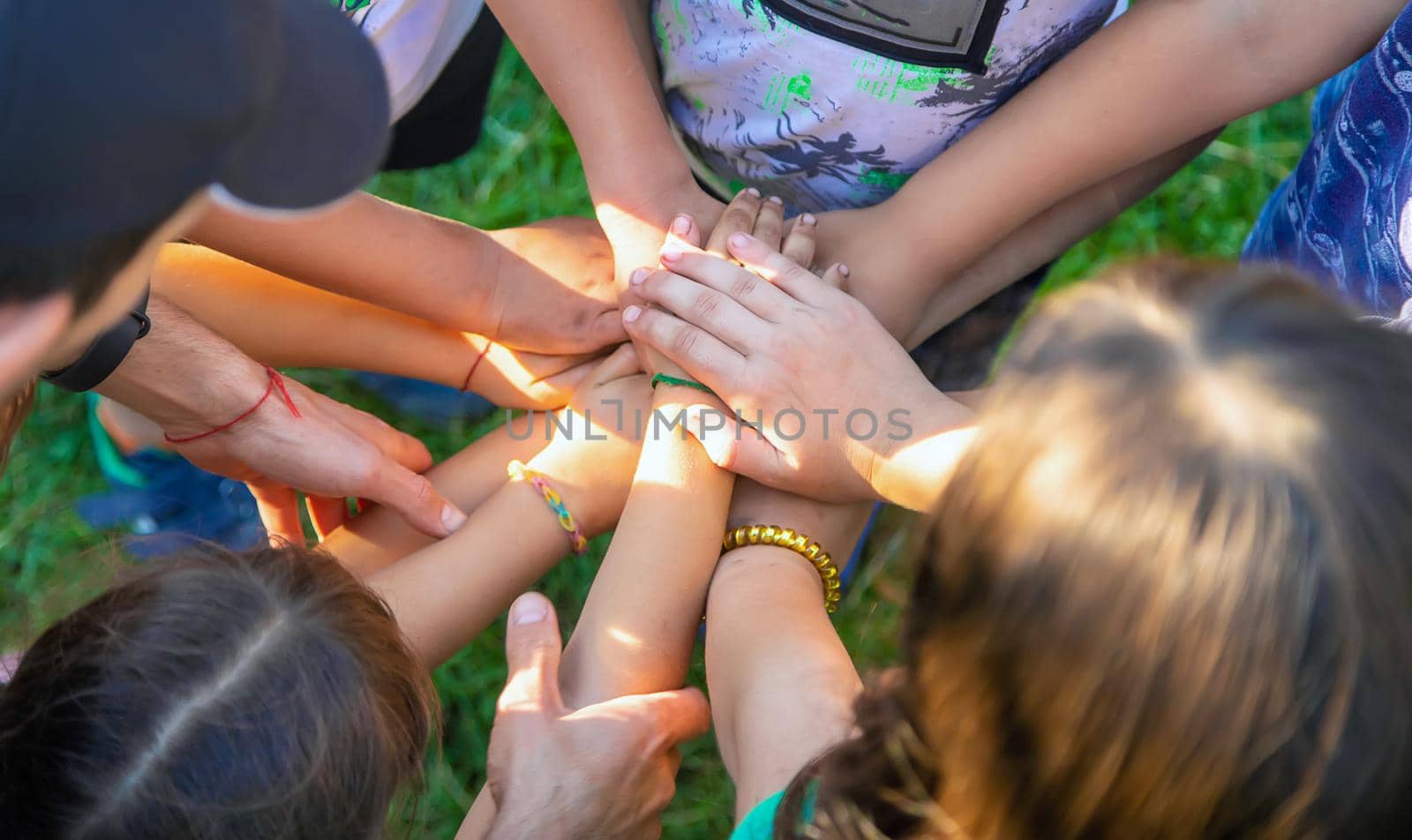 The children put their hands together. Selective focus. people.