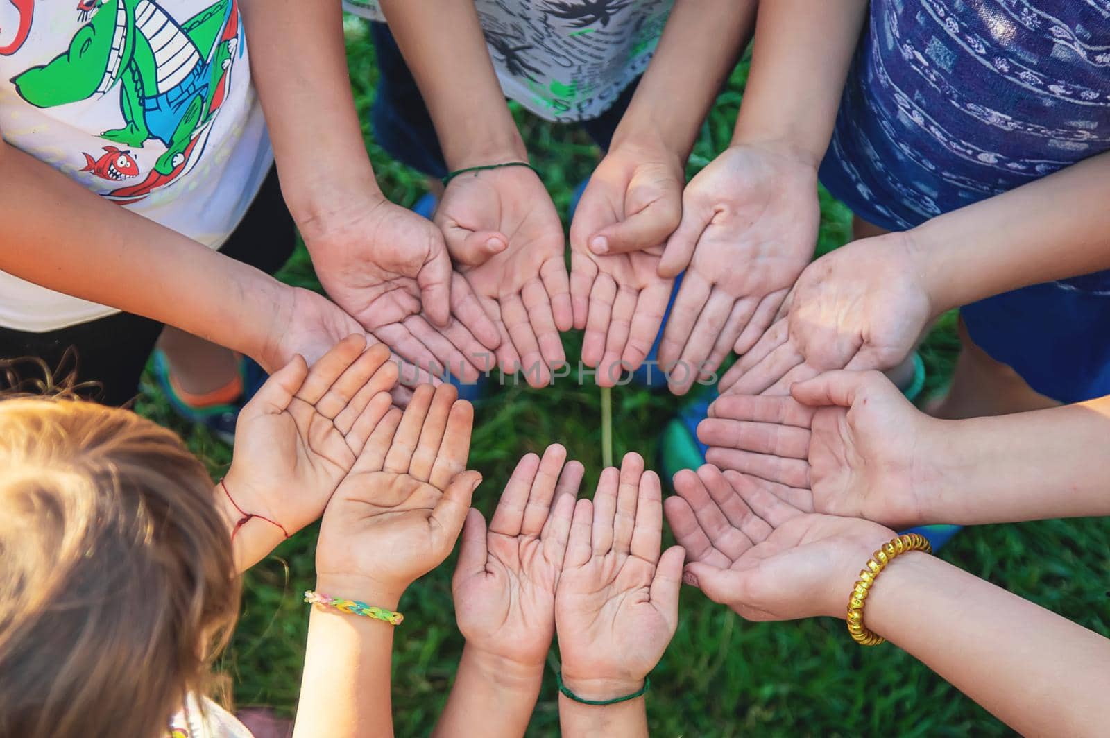 The children put their hands together. Selective focus. by yanadjana