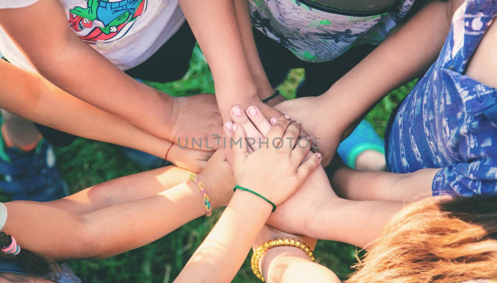 The children put their hands together. Selective focus. by yanadjana