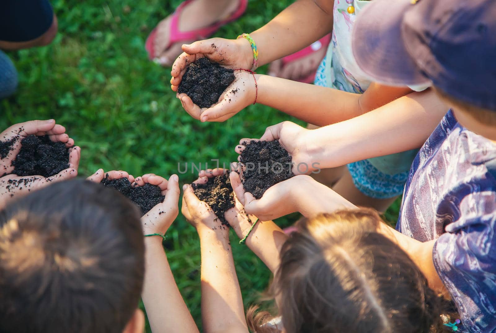 Children hold the earth in their hands. Selective focus. nature.