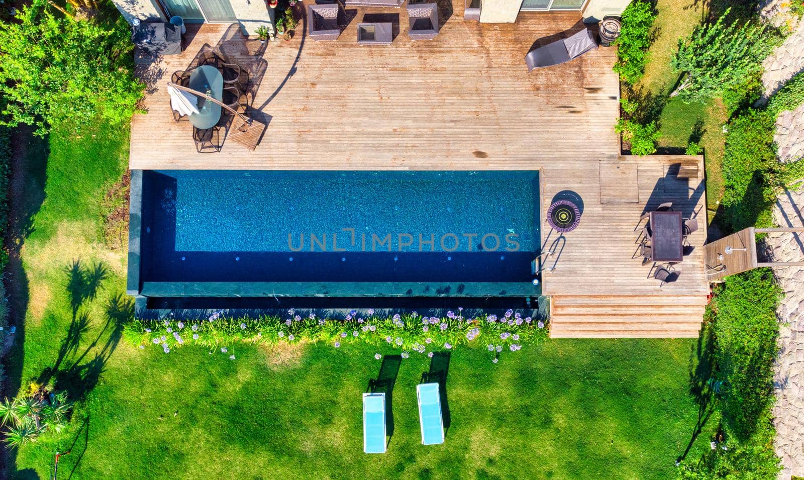 Aerial view of swimming pool outside hotel. High quality photo