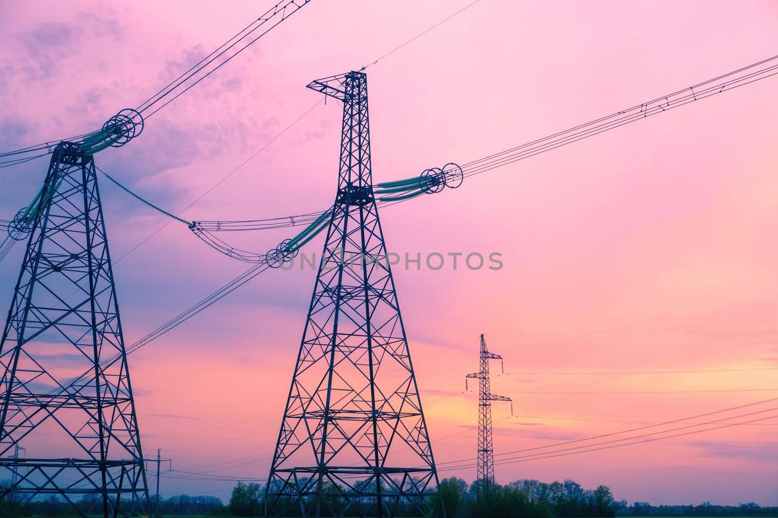 Electric high voltage post, High voltage energy transmission. Grid of high voltage post.High-voltage tower sky background. Power distribution. Download photo