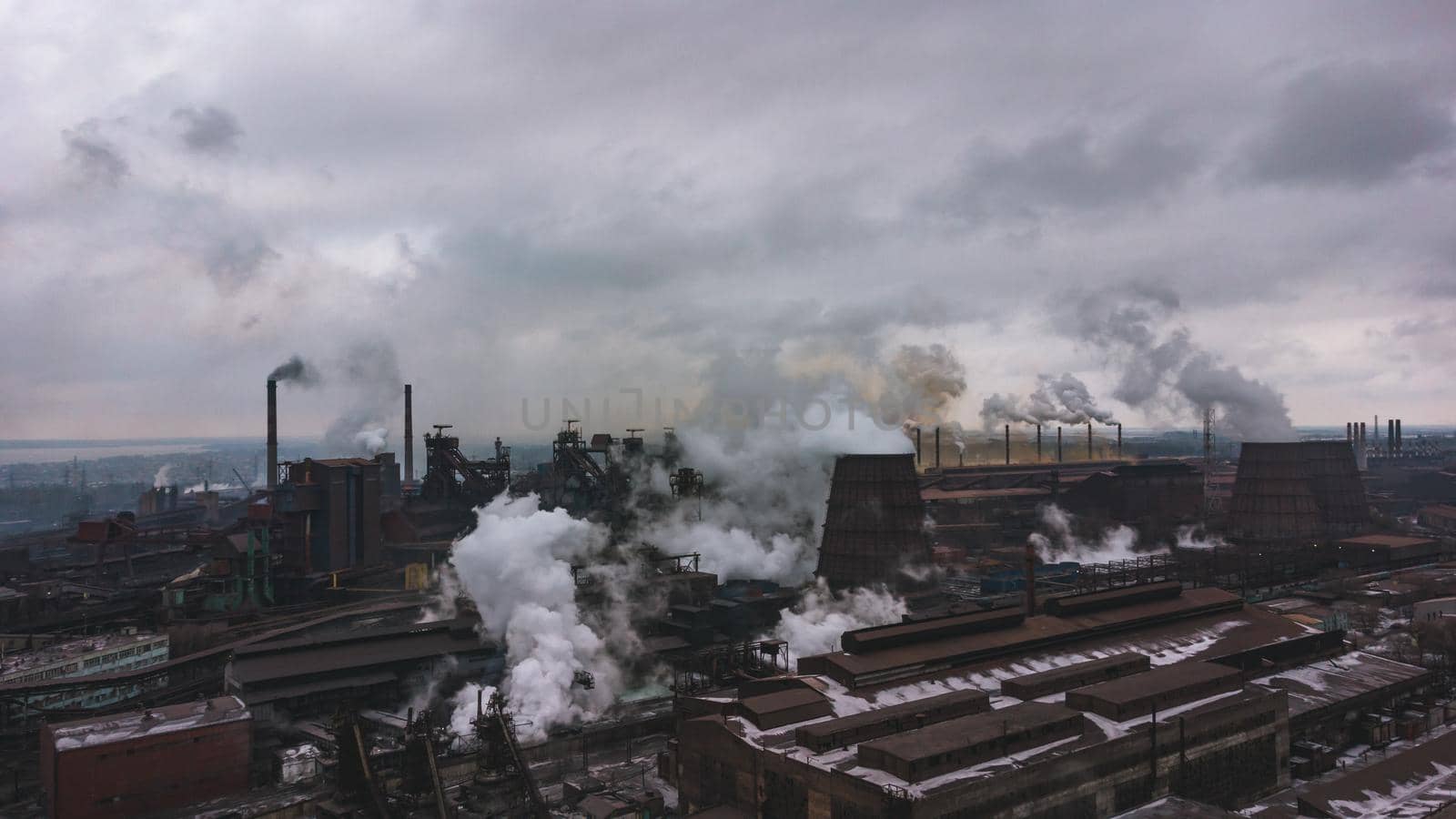 industry metallurgical plant dawn smoke smog emissions bad ecology aerial photography. climate change. industrial background. Aerial shot of industrial air pollution