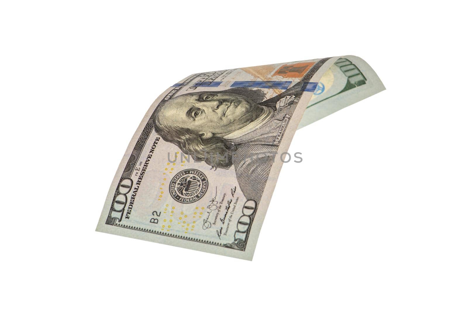 Isolate on white hundred dollar bills. American money folded in half, close-up