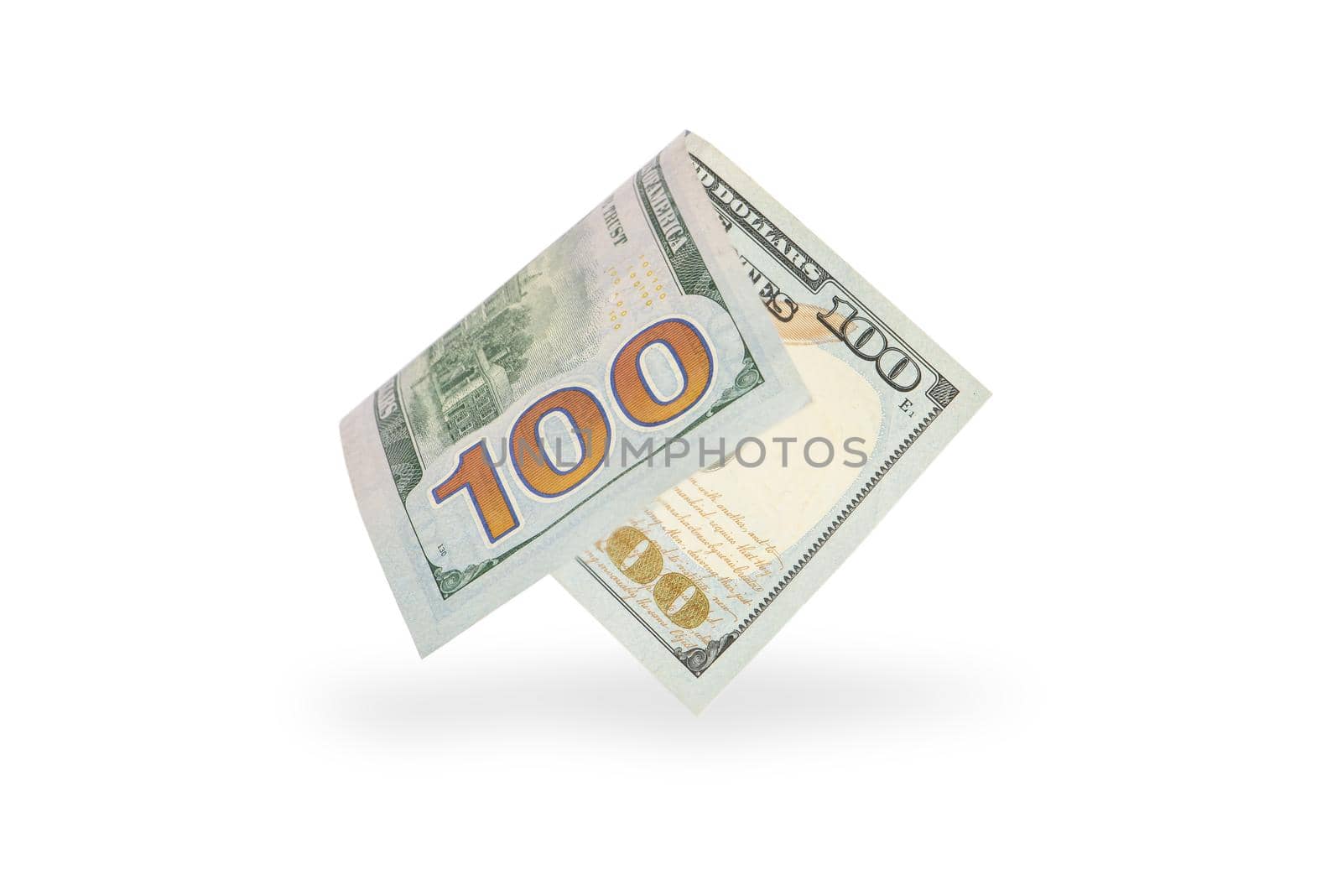 Hundred dollar bill falling casting shadow, half-folded bill close-up on white background.