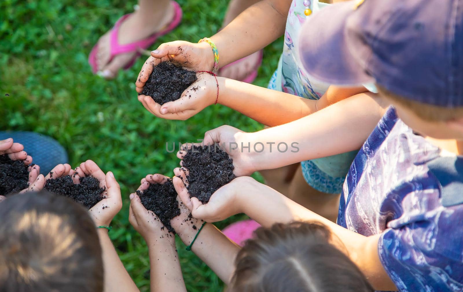 Children hold the earth in their hands. Selective focus. nature.
