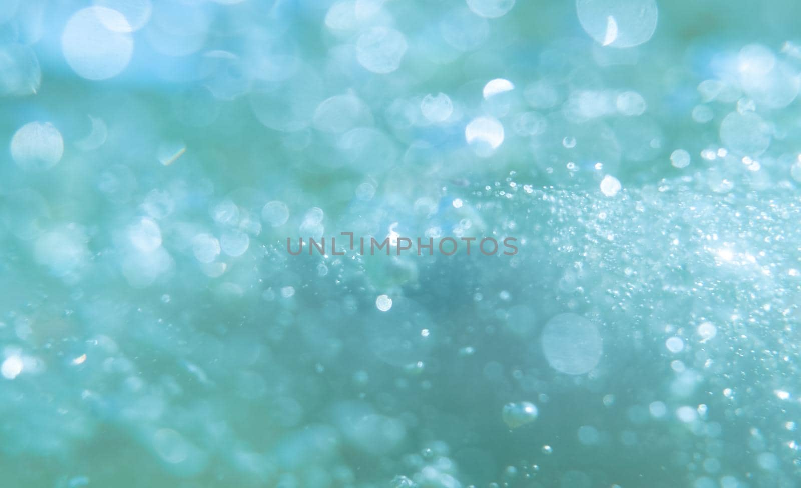 defocused abstract background with bubbles. Underwater bubbles with shiny blur through water surface, natural scene