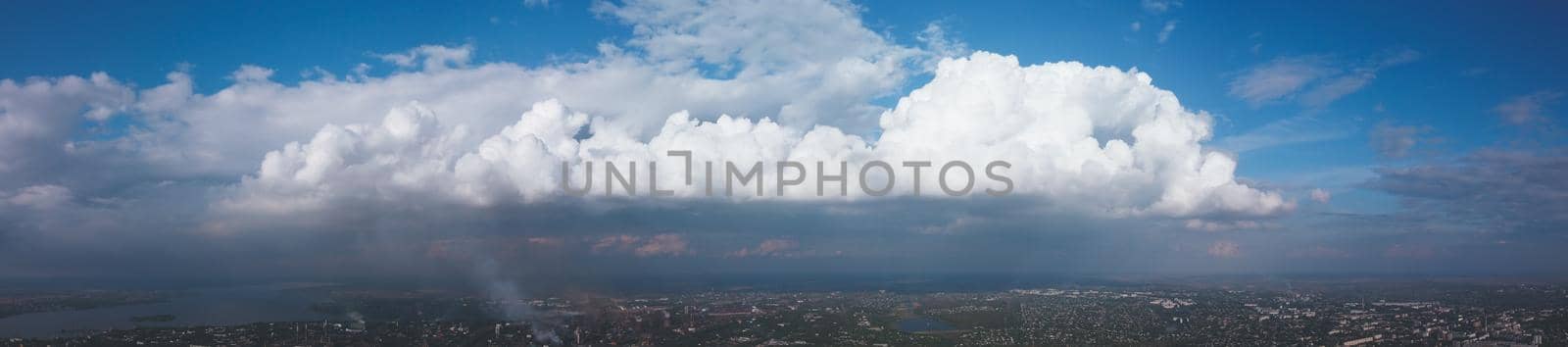 panorama of low blue sky and clouds. Sunset on huge clouds float on the blue sky. panorama sky