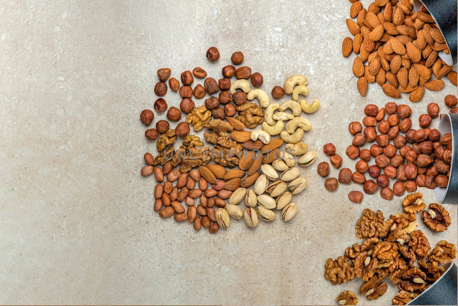Nuts background, top view. The natural background is made from different varieties of nuts.
