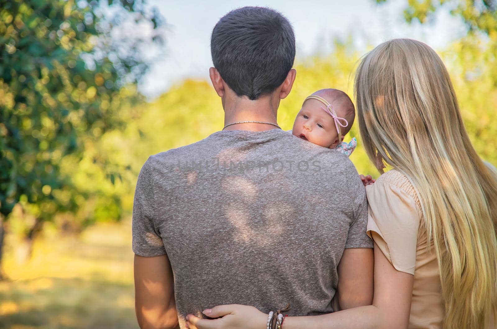 Family photo with a newborn baby. Selective focus. People.