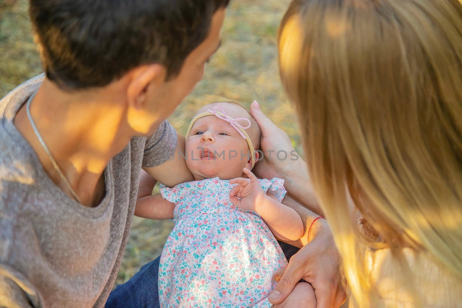 Family photo with a newborn baby. Selective focus. People.