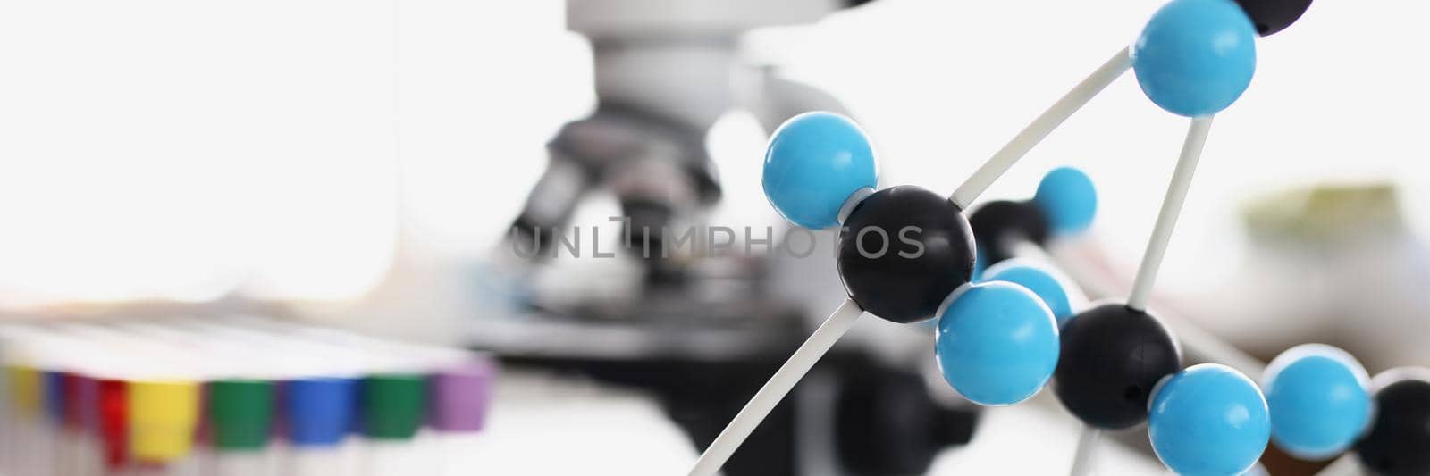 Close-up analyzing model of carbazole molecular structure in laboratory, chemical formula. Modern lab centre with equipment. Science, discovery, experiment, knowledge concept