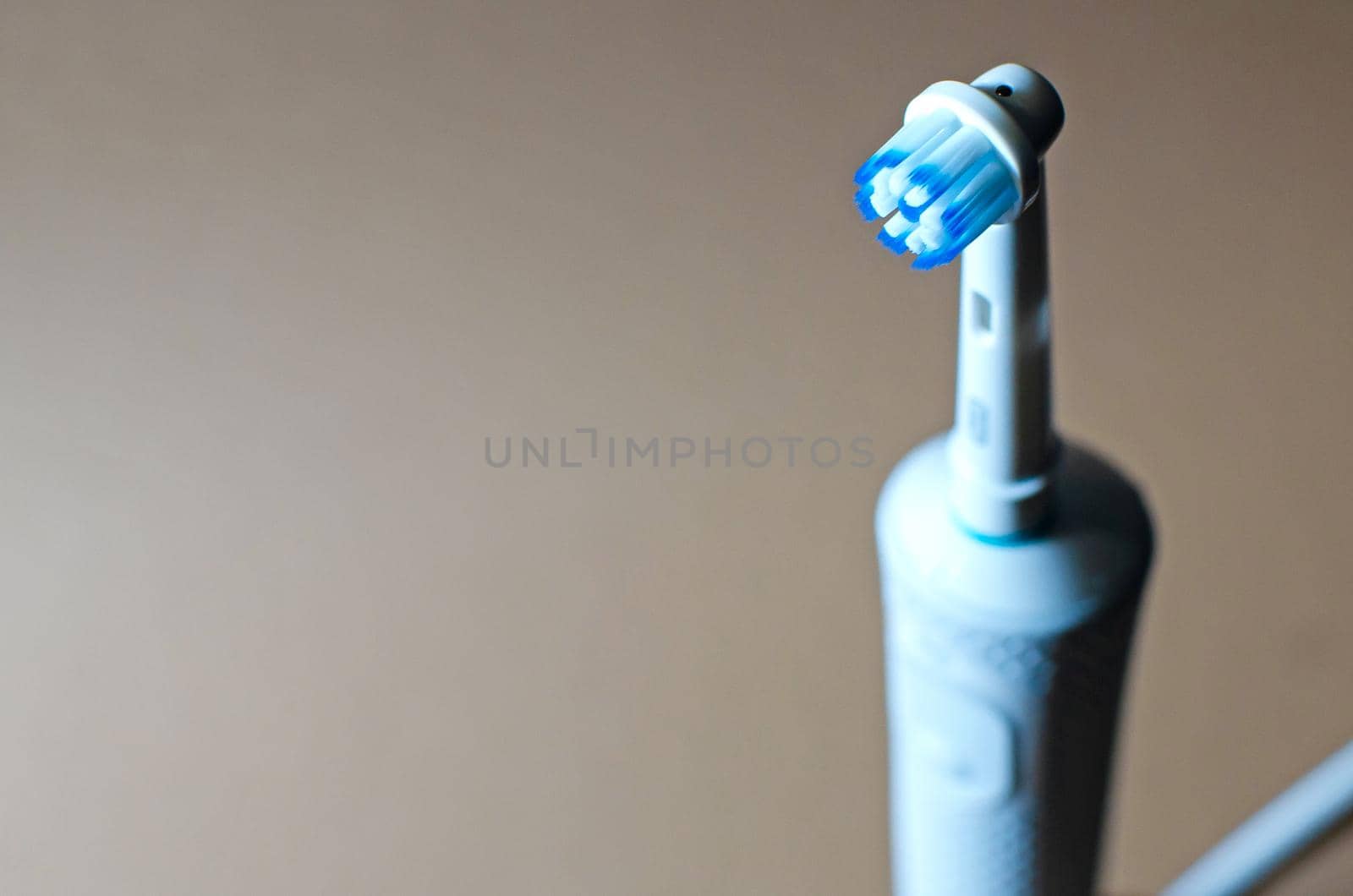 Electric toothbrush, top view close-up Charger Rechargeable