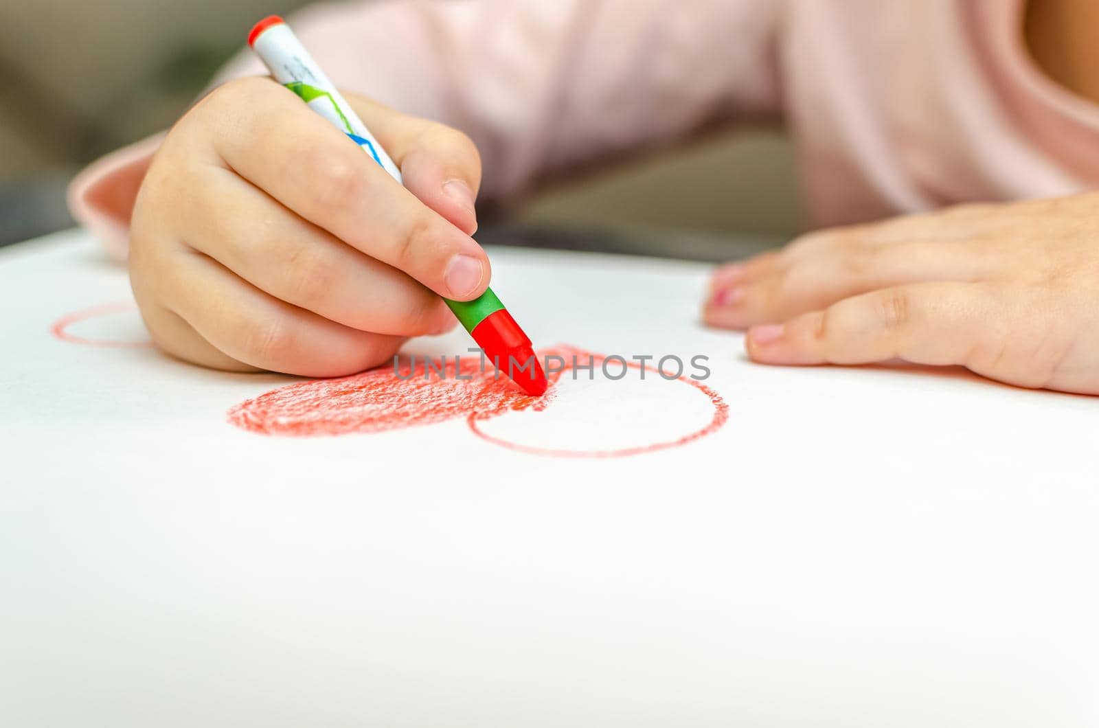 valentine's day, girl draws heart on paper, copy space.
