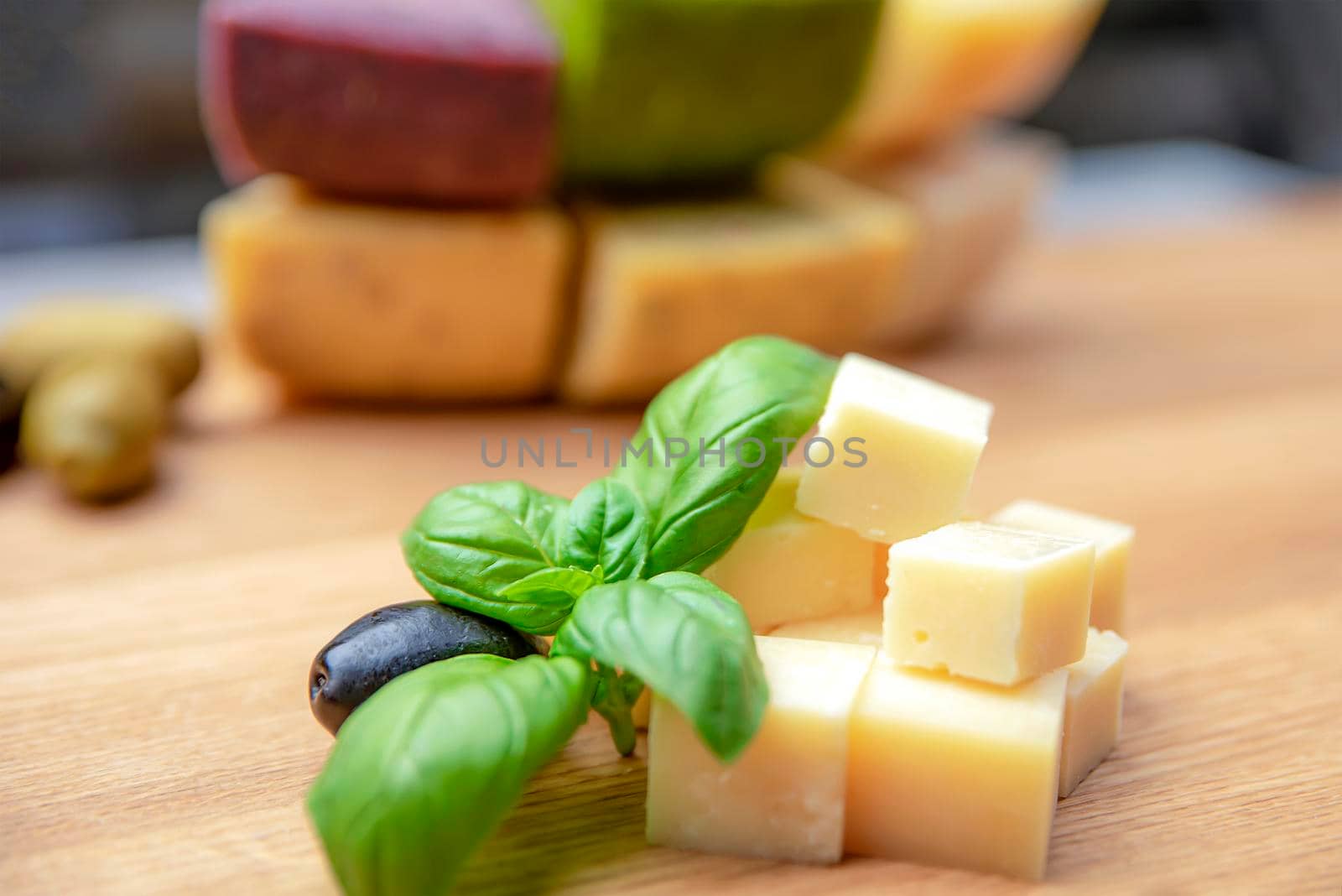 Cheese background. Assortment of different types of cheese on a wooden background.Place for text.