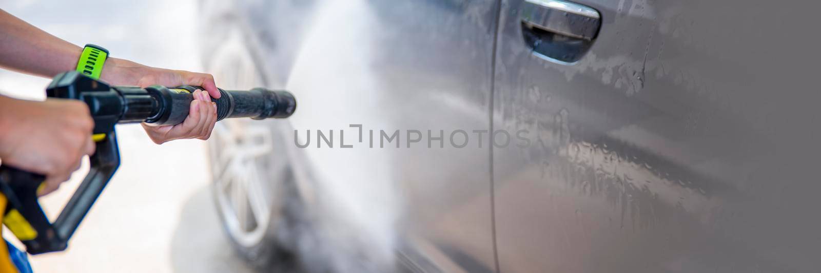 Car wash with water under pressure. Self-service, car wash advertisement with space for copy space or paste text. by SERSOL