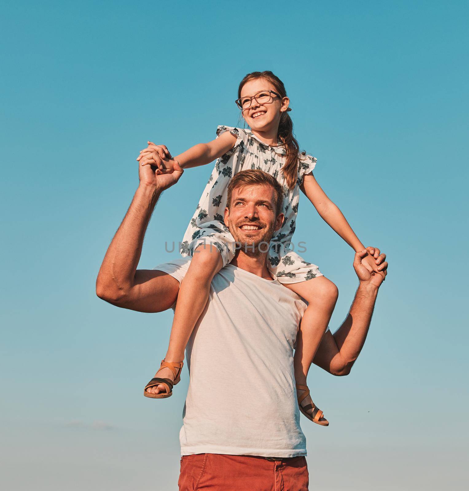 child family outdoor man father girl happy happiness lifestyle having fun bonding piggyback daughter by Picsfive
