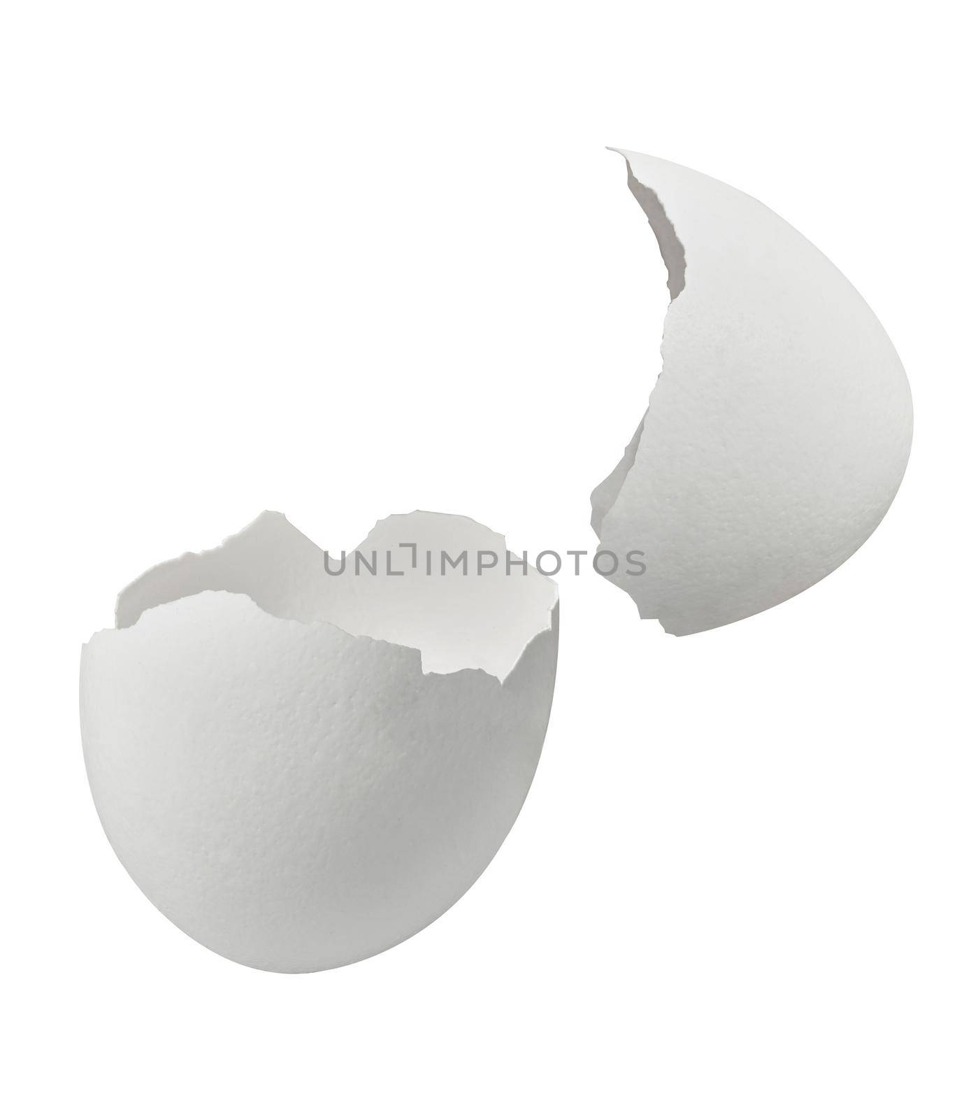 Close up of a broken white eggshell on white background