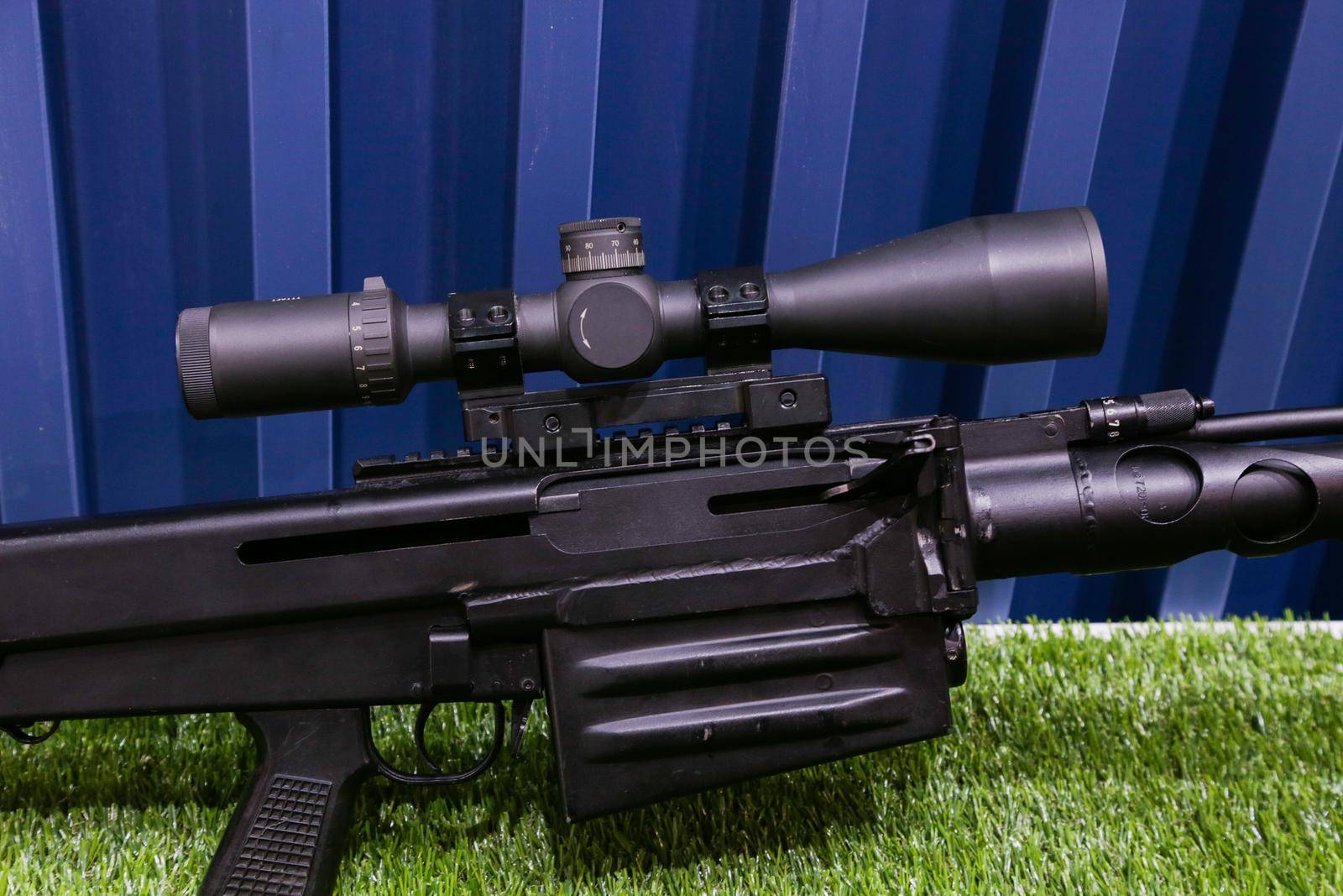 Sniper rifle with telescopic sight close-up. by gelog67