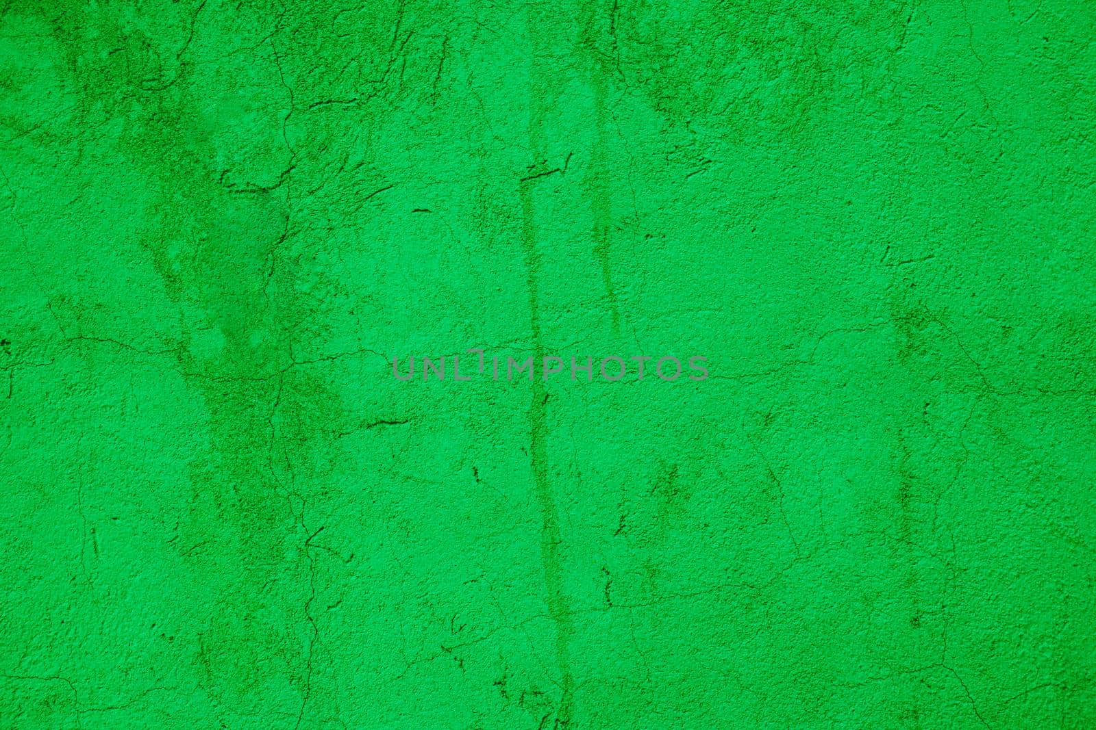 Scuffed peeling green plaster on the wall. by gelog67