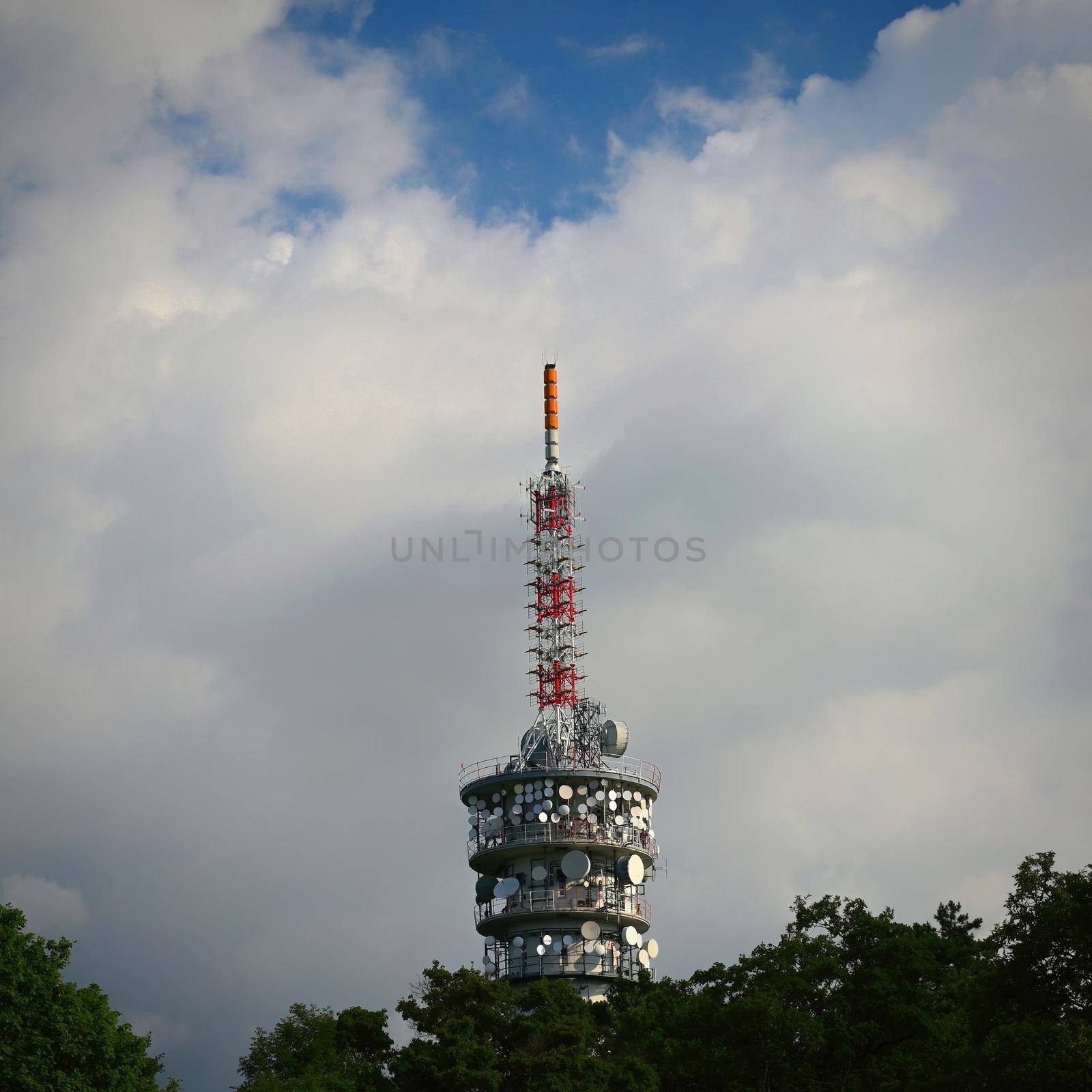 Large TV transmitter with satellite dishes and other antennas. Internet - wifi - mobile gsm signal. Concept for technology and industry. Brno - Hady. by Montypeter