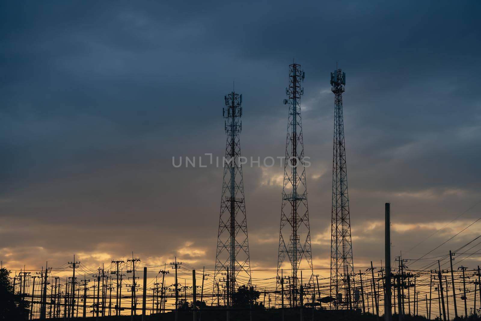 high voltage post.High voltage tower at power plant sunset evening golden time  sky background