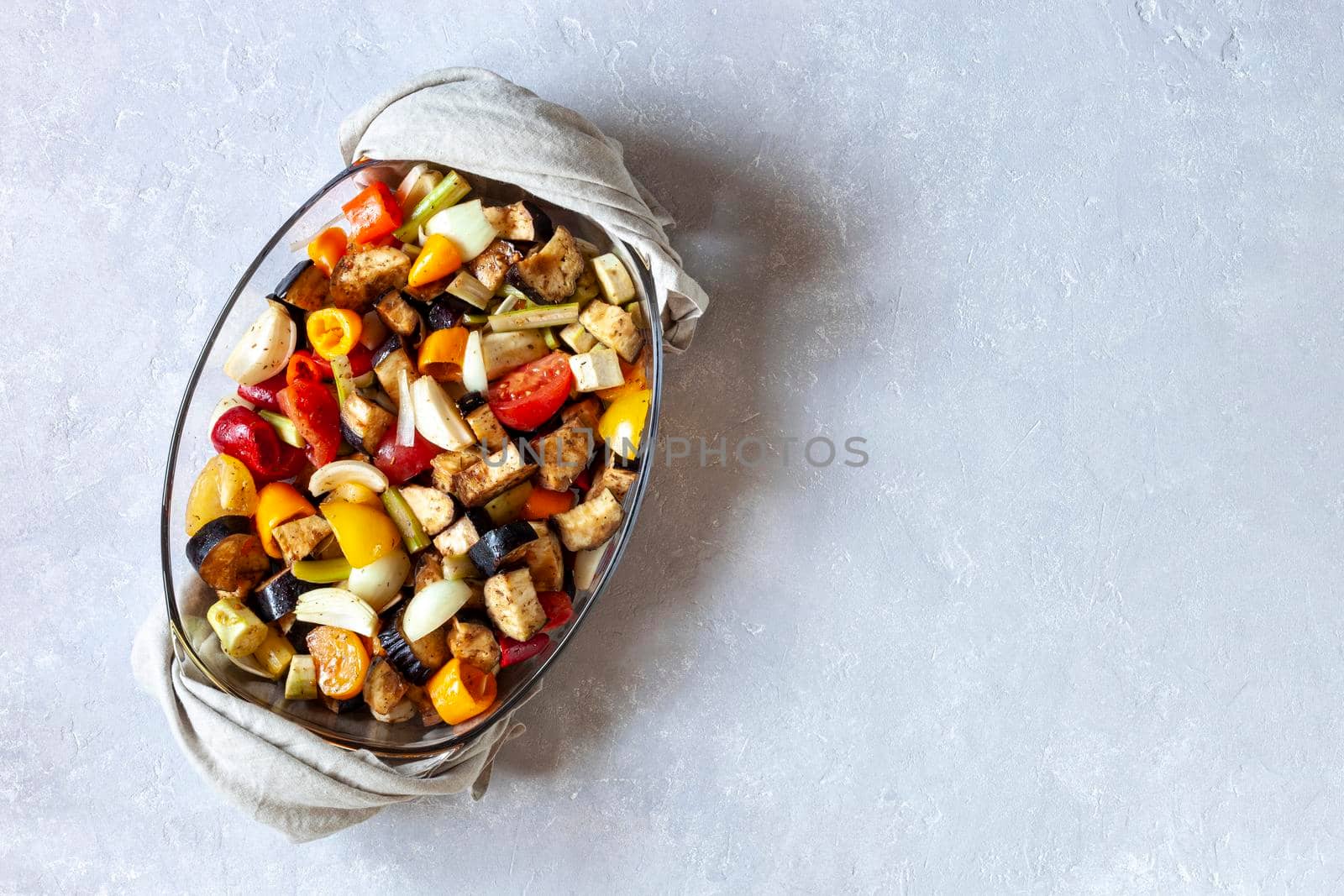 baking dish with vegetables ready to bake, top view, copy space