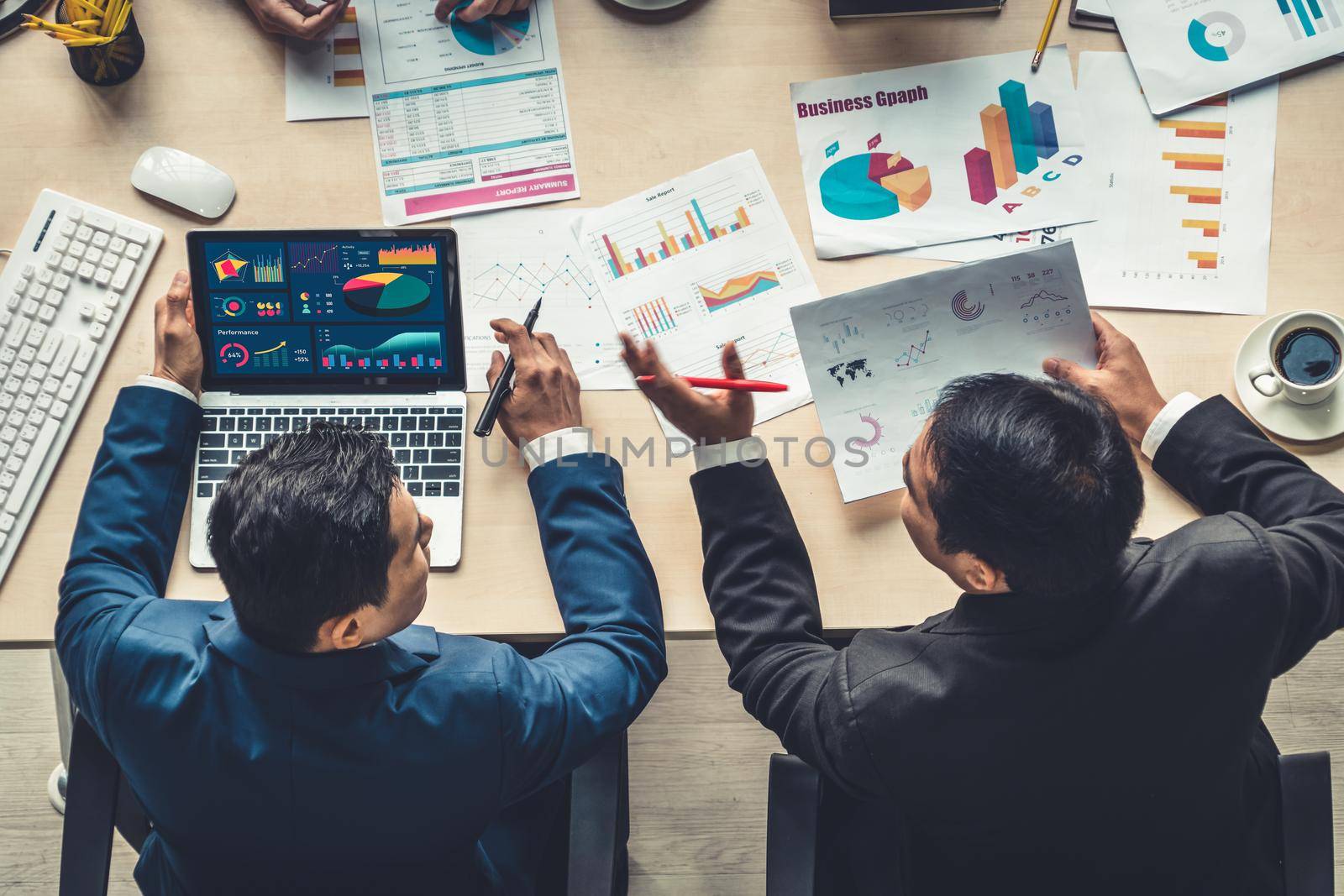 Business data dashboard analysis by ingenious computer software . Investment application display business sales and profit on the computer screen and advise marketing planning decision .