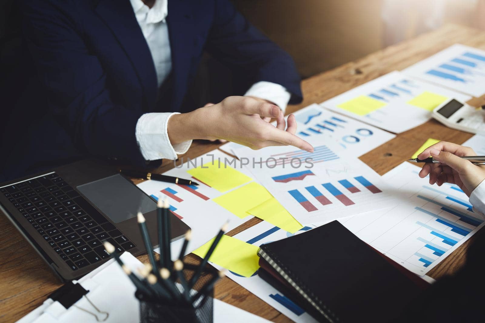financial, Brainstorming, Consulting, Data Analysis, Planning, Marketing and Accounting, Economist pointing to investment documents with partners on profit taking to compete with other companies
