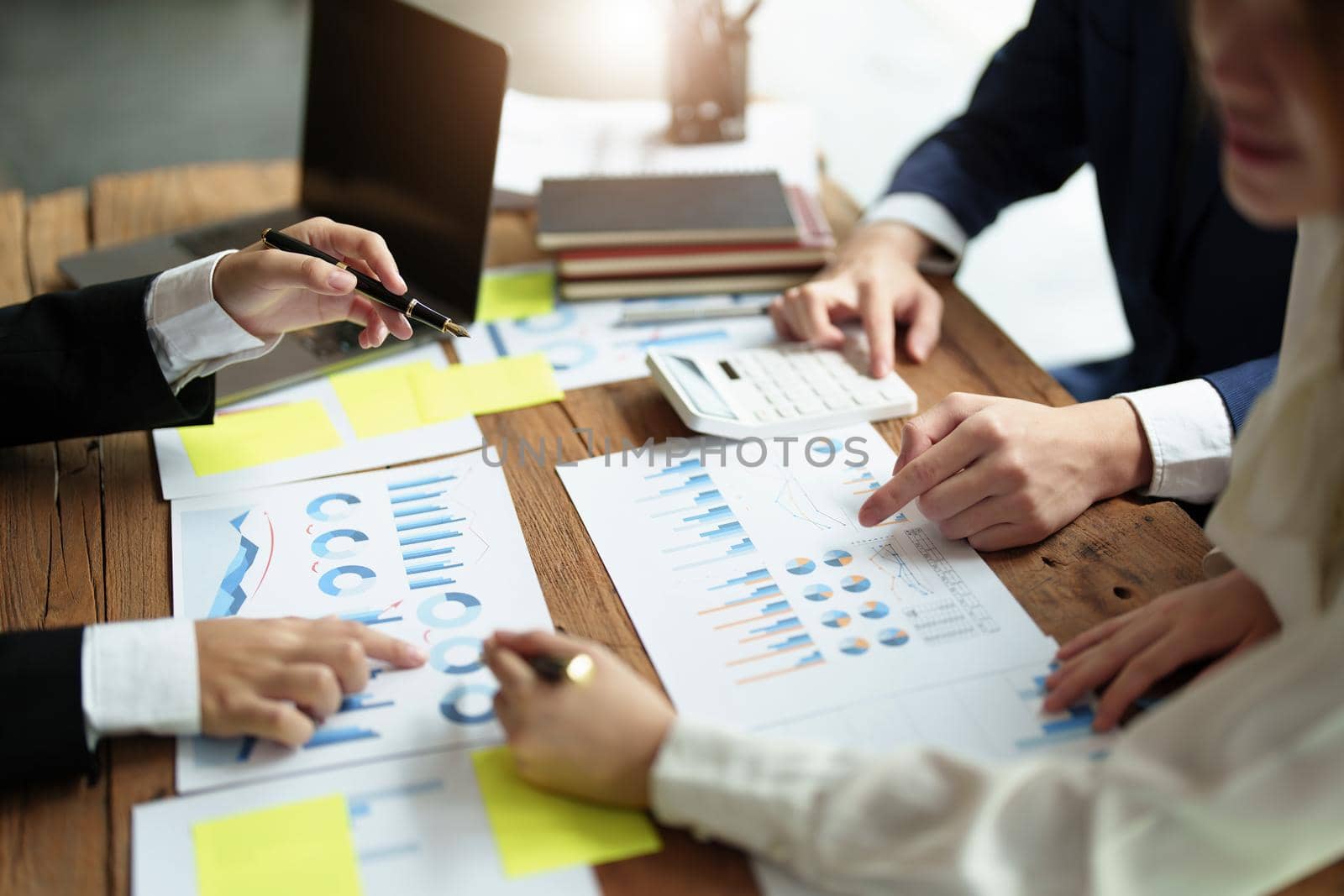 financial, Brainstorming, Consulting, Data Analysis, Planning, Marketing and Accounting, Economist pointing to investment documents with partners on profit taking to compete with other companies. by Manastrong