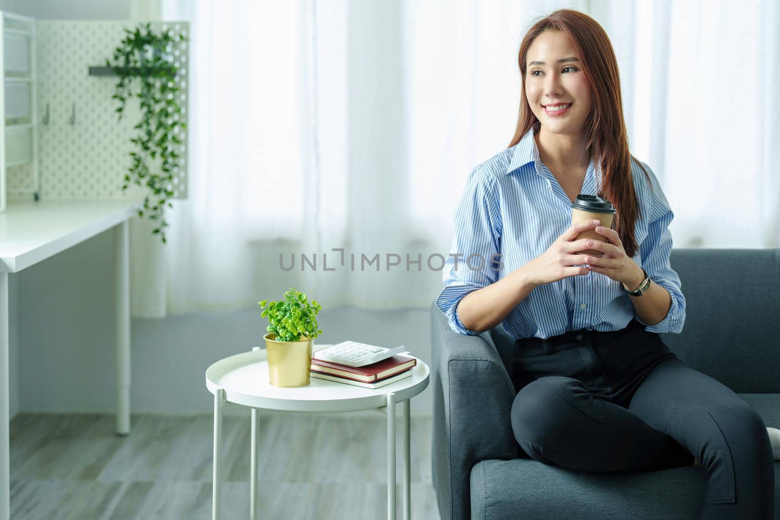 Entrepreneurs, Business Owners, Accountants, Portrait of a Small Business Startup Asians hold happy smiling faces while drinking coffee while taking a break from work