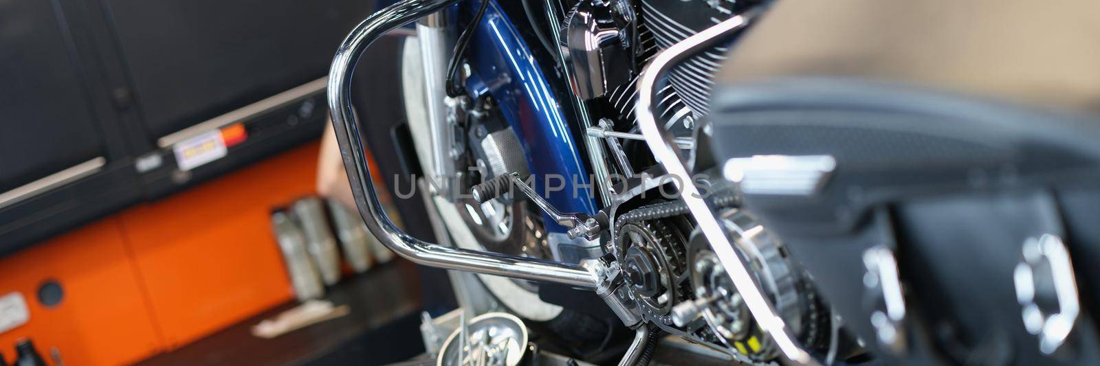 Motorcycle and parts in the garage kitchen, close-up. Pedal replacement, transmission tuning, upgrade motorbike