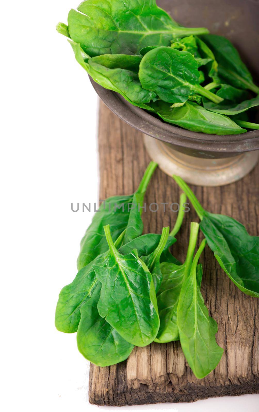 fresh spinach isolated on white background closeup
