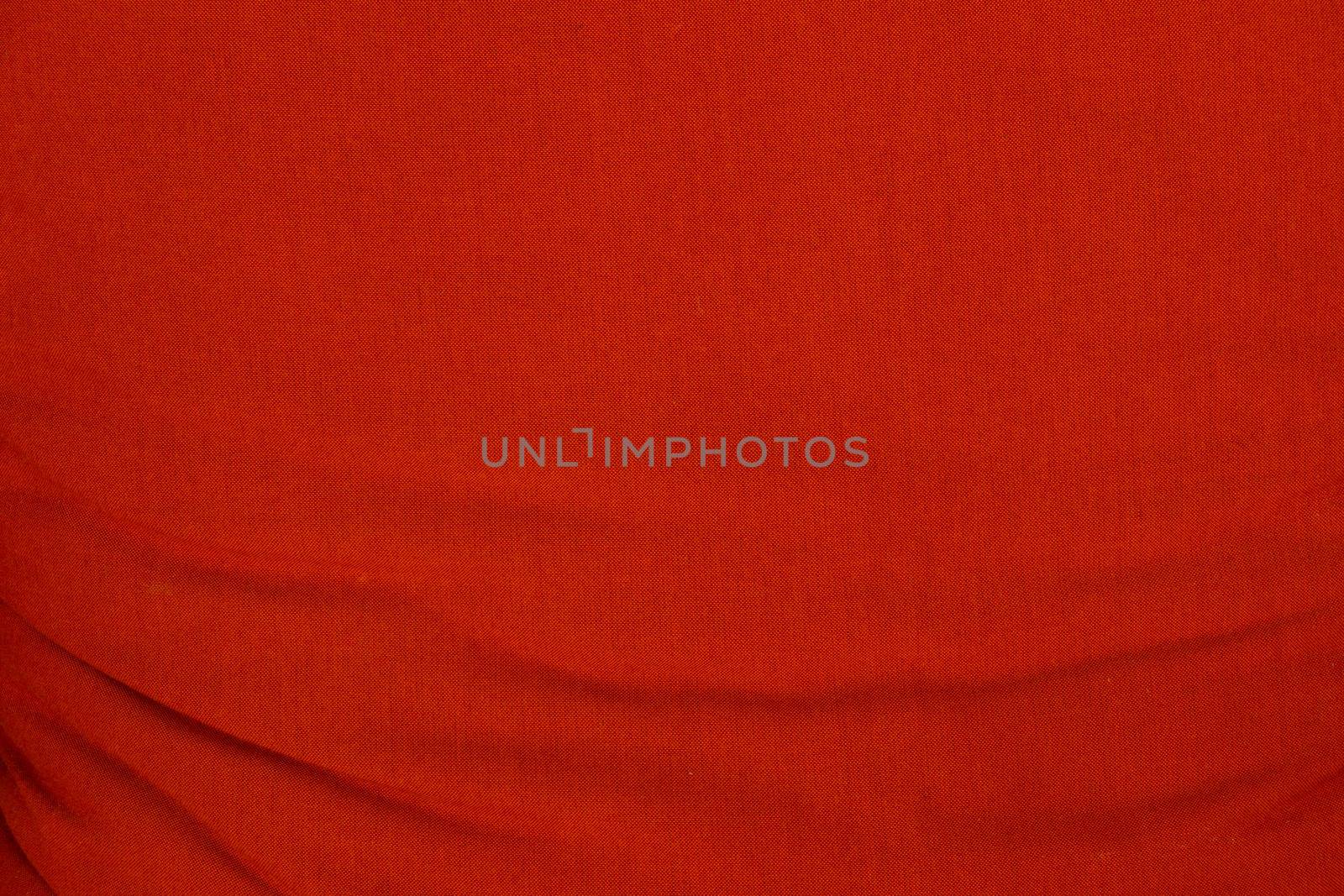 Red wrinkled fabric texture for background by kaisorn