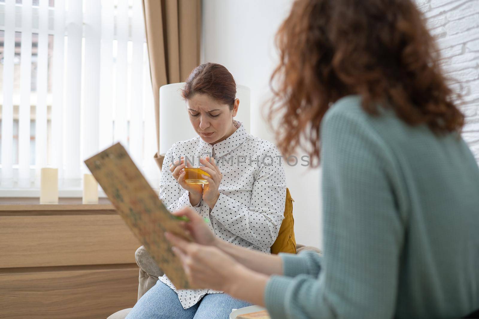 Worried caucasian woman at a session with a psychotherapist