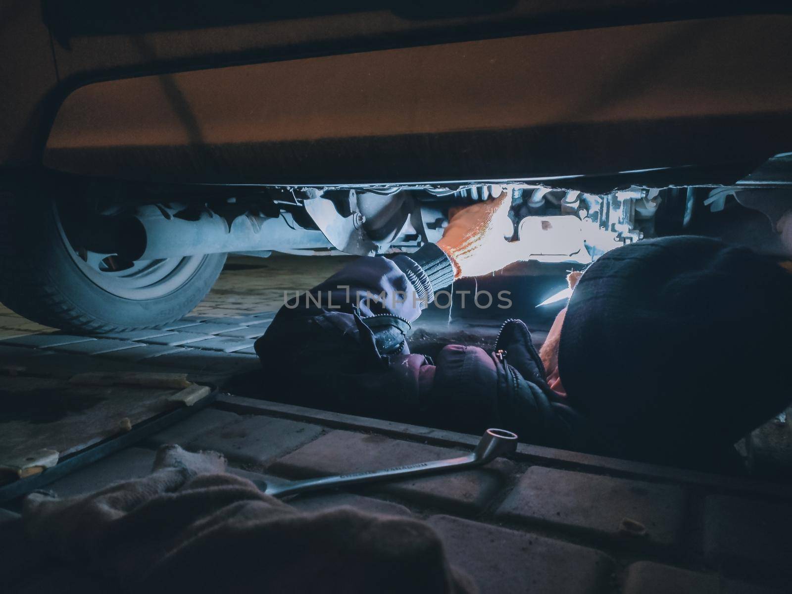 Man repairs his car. Repairing a car. maintenance of car