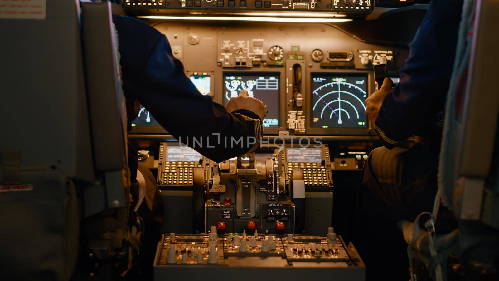 Airplane captain throttling engine to takeoff and fly plane, using power handle and control panel command. Pushing lever to travel and use aerial navigation, flying aircraft. Close up.