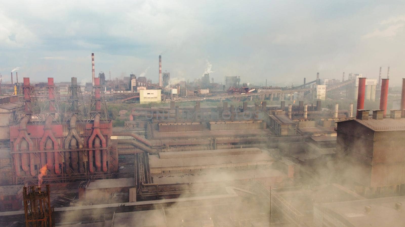 Panoramic view of heavy industry with detrimental impact on nature. CO2 emissions, toxic poisonous gases from chimneys. dirty pipelines and clouds of smoke