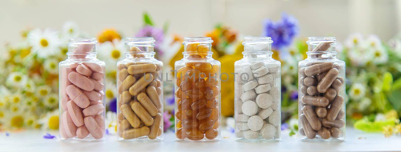 Homeopathy and dietary supplements from medicinal herbs. Selective focus. Nature.