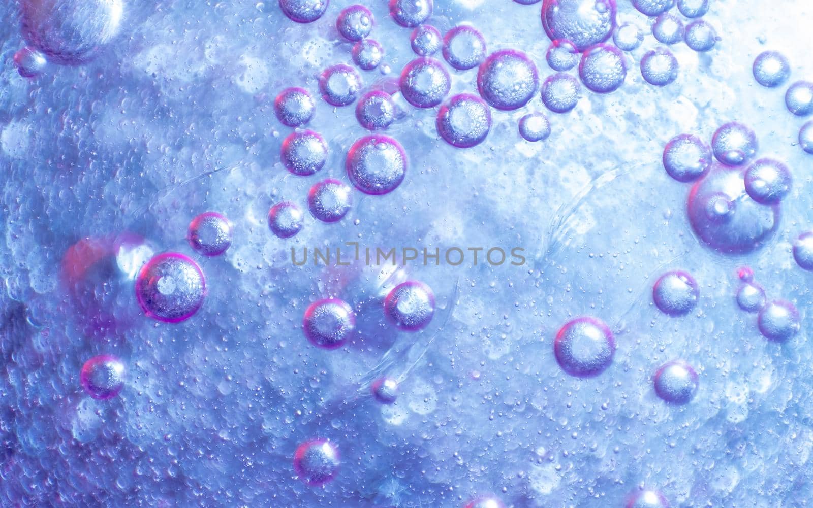 water drops on purple background. colored abstract background. by igor010