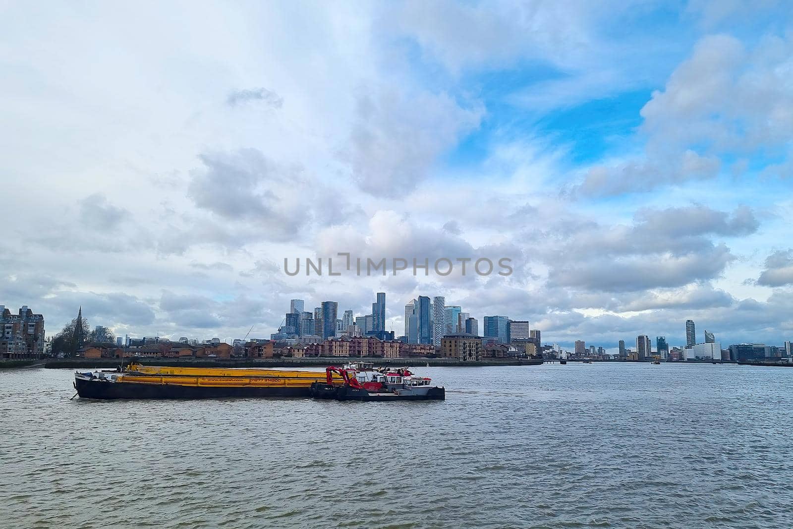London, United Kingdom, February 7, 2022: Beautiful view of the tall buildings of London from the River Thames. by kip02kas