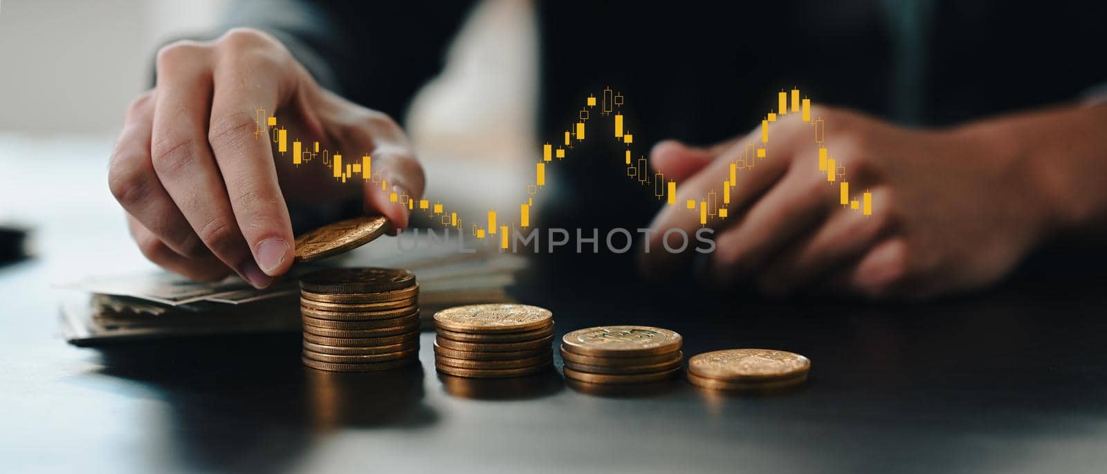 Stock market, business growth and strategy concept. Businessman holding gold coin with virtual screen of stock market changes.